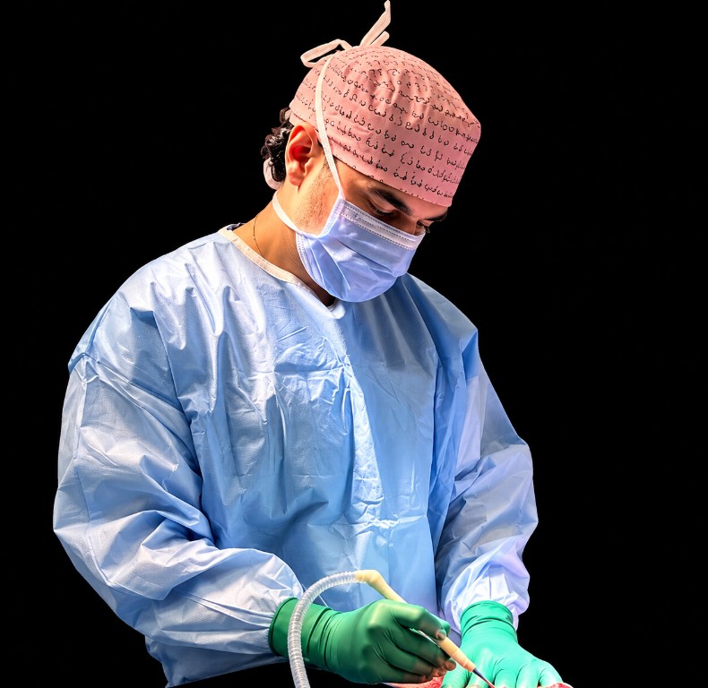 Dr. Jaberi operating on a breast surgery patient in the operating room
